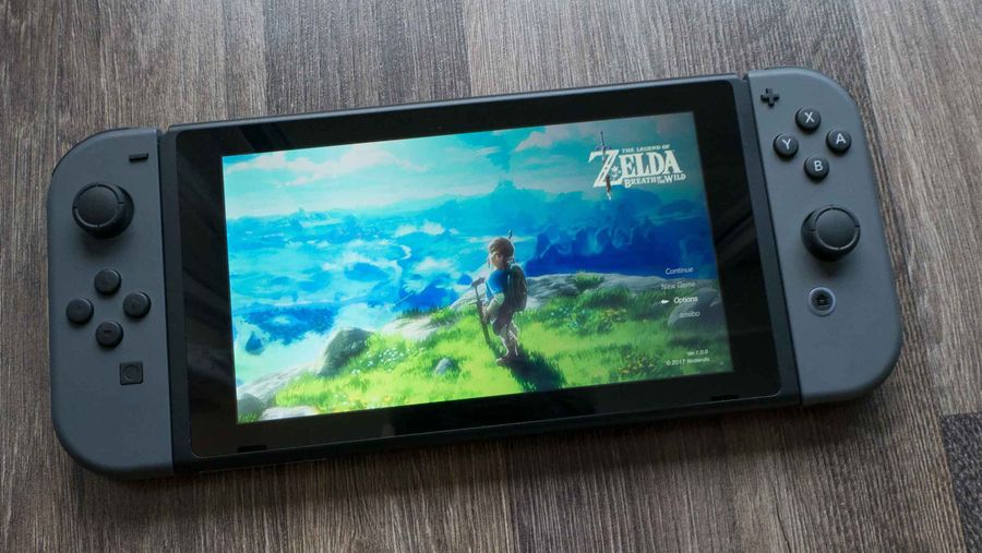 Nintendo Switch sitting on the ground with Joy-cons