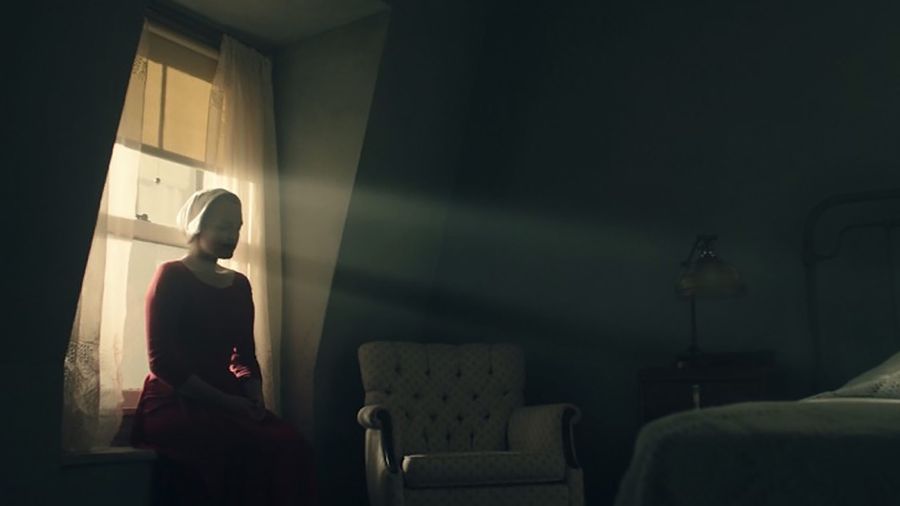 The Handmaid's Tale woman sitting
