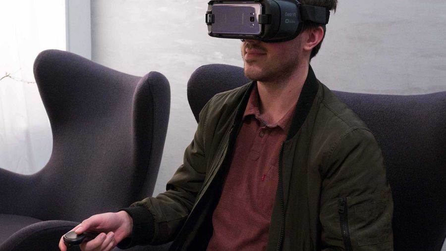 Man with VR headset watching content