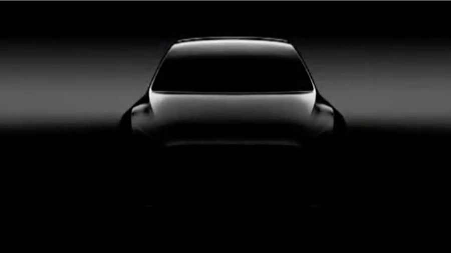 A shadowy image of Tesla's upcoming Model Y crossover SUV