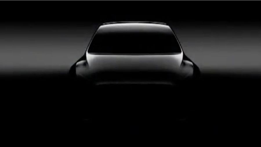A shadowy image of Tesla's upcoming Model Y crossover SUV