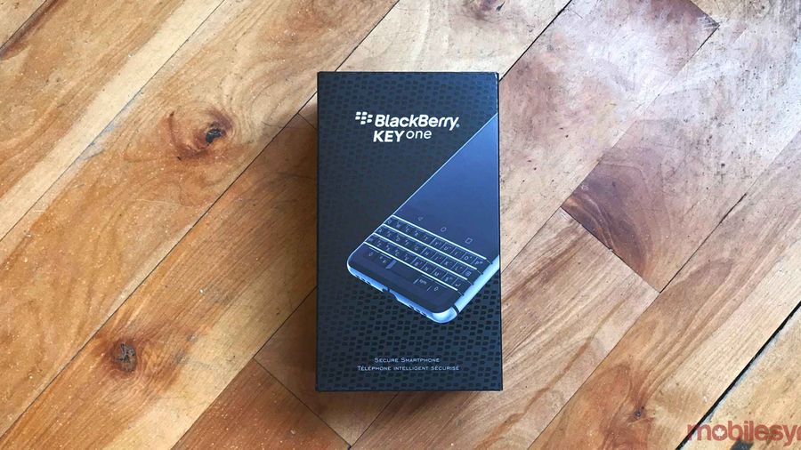 blackberry keyone box laying on hardwood floor