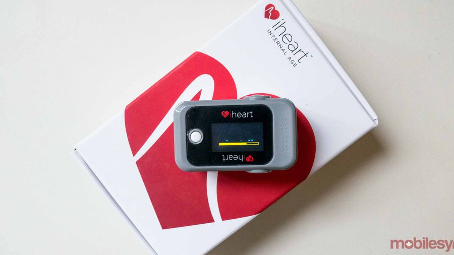 An image showing the iHeart monitor resting on its packaging