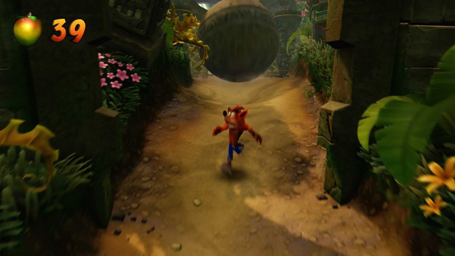 Crash Bandicoot running from boulder
