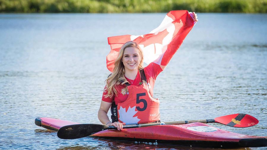 woman with Canadian flag in kayak