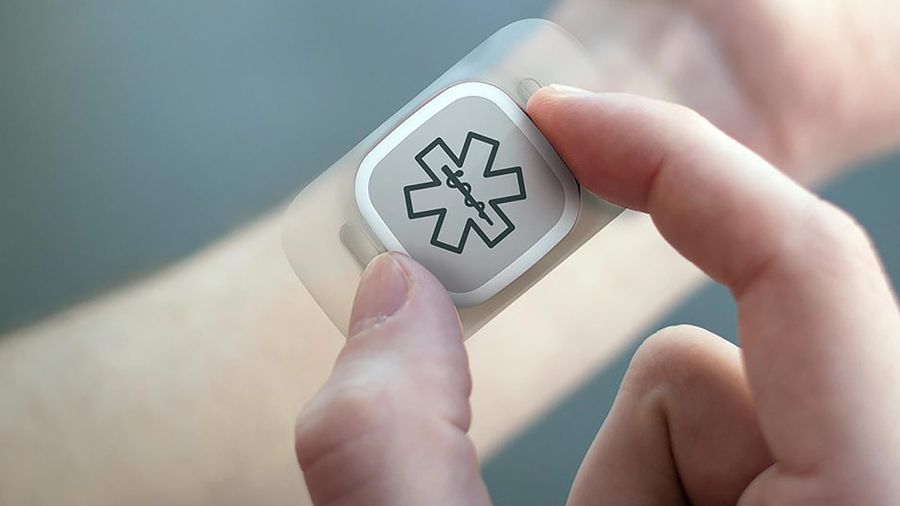 Wearable in hand with medical symbol