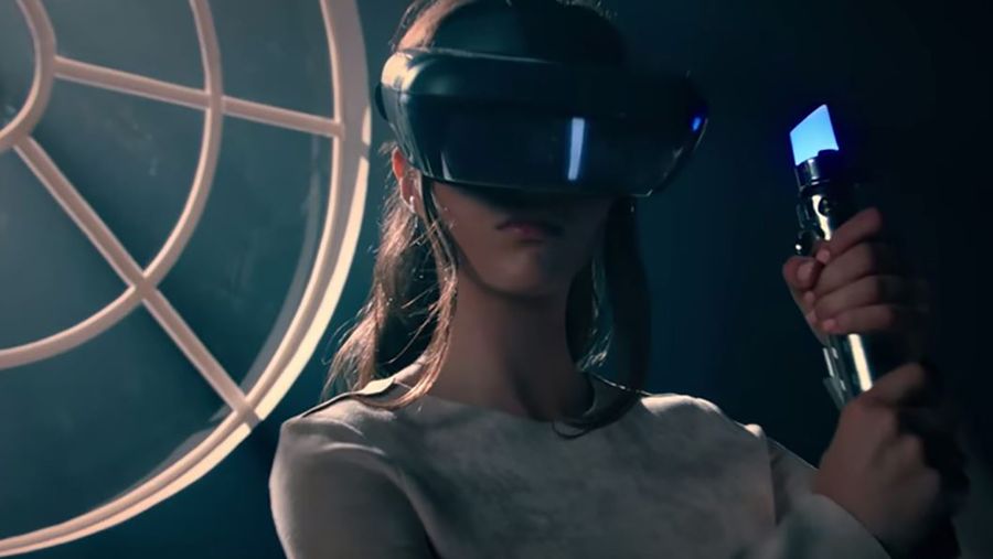 Star Wars themed headset with motion controlled light saber for Jedi Challenges experience
