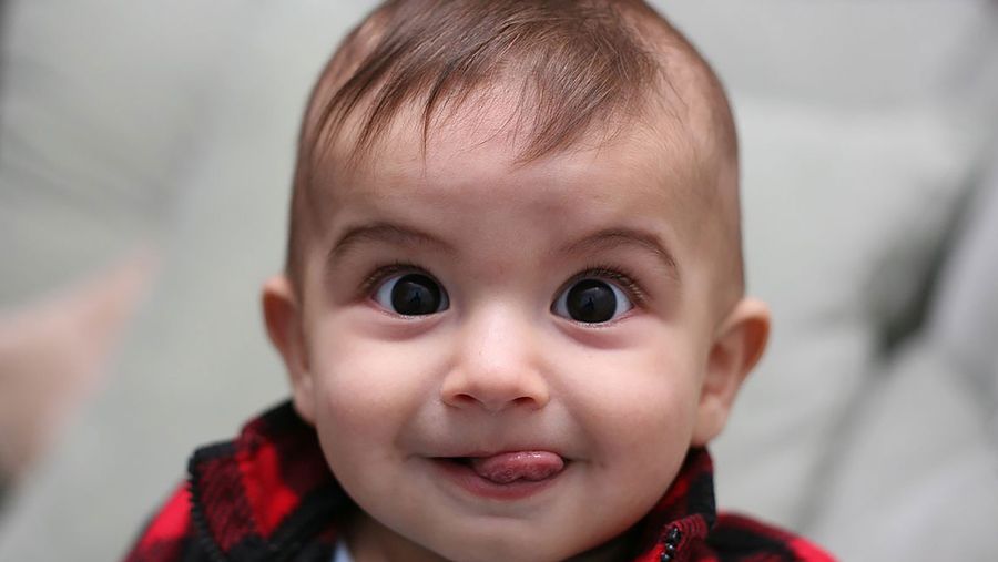 Cutest baby sticking out tongue