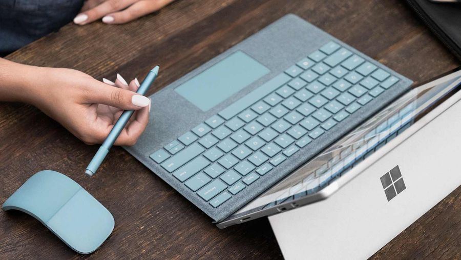 Aqua coloured windows arc mouse, surface pen and surface type cover