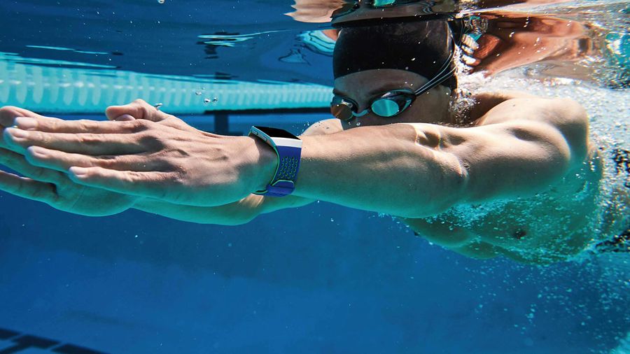 Swimmer using Fitbit Ionic smartwatch