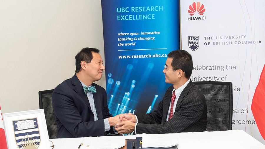 Huawei Canada president with president of UBC