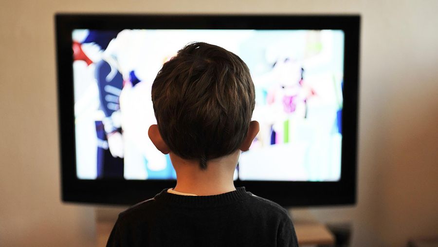 Child in front of screen