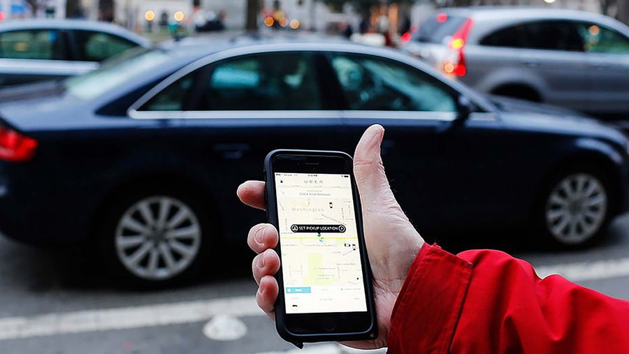 Uber app on phone car pickup