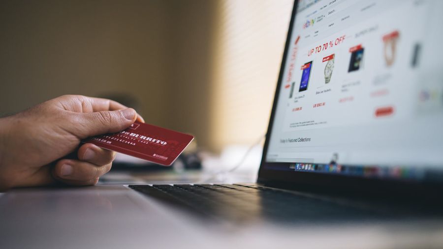 online shopping, had holding credit card with Mac in front