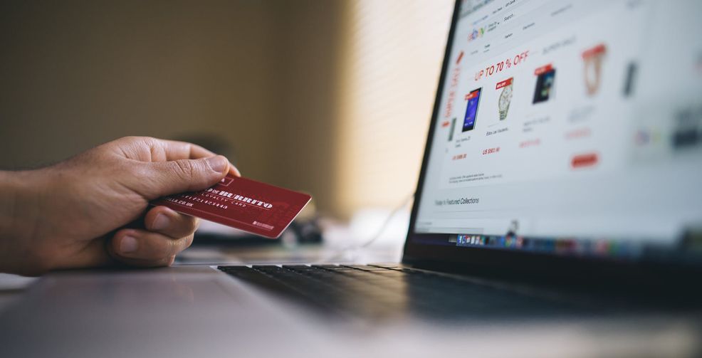 online shopping, had holding credit card with Mac in front