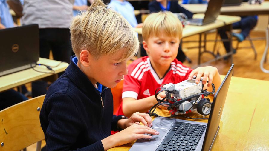 Children coding on table