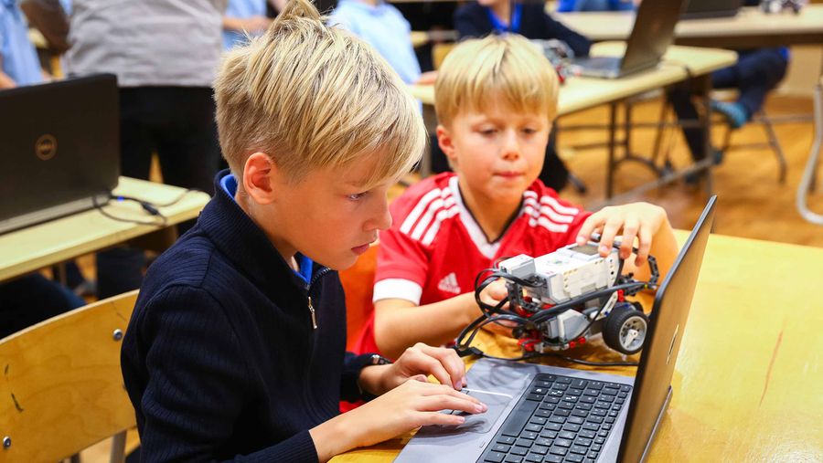 Children coding on table