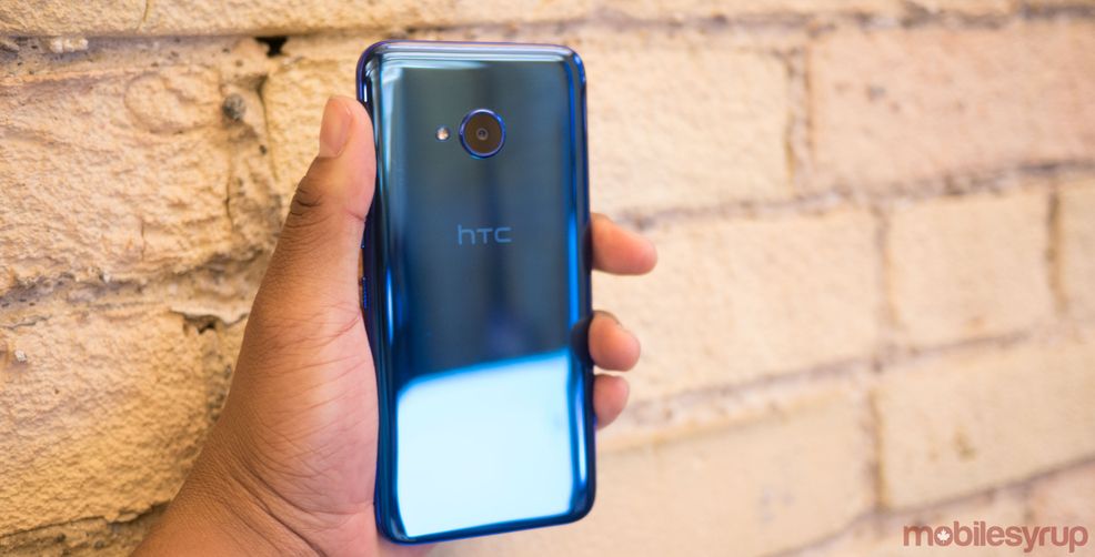 HTC phone in hand