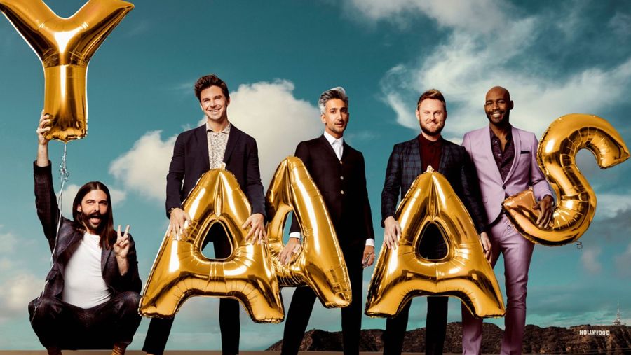 Queer Eye carrying Ballons that say Yaas