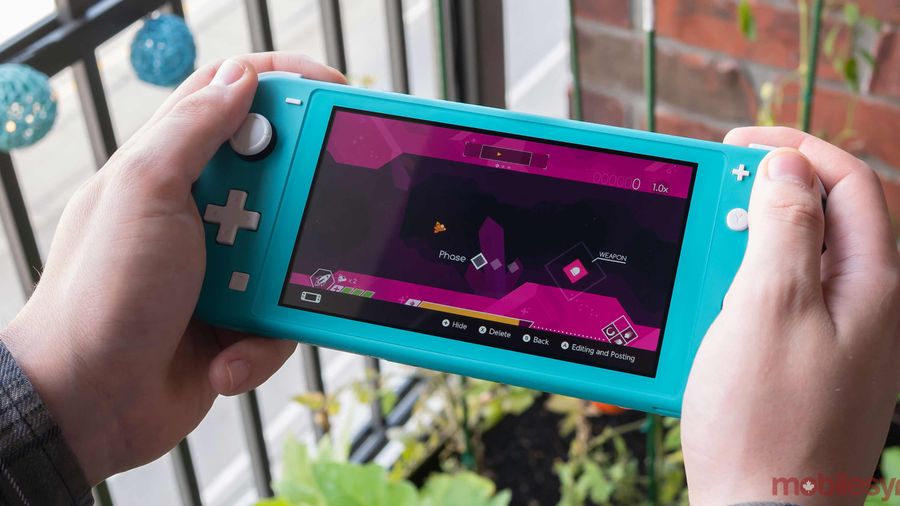 Nintendo Switch Lite in hand