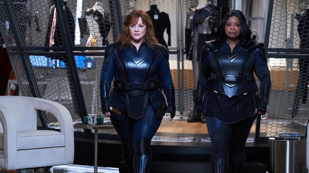 Melissa McCarthy and Octavia Spencer walking beside each other in skin tight black Thunder Force outfit