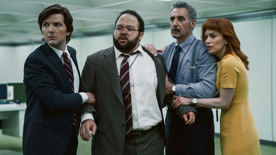Adam Scott, Zach Cherry, John Turturro and Britt Lower watch on with concern in Severance