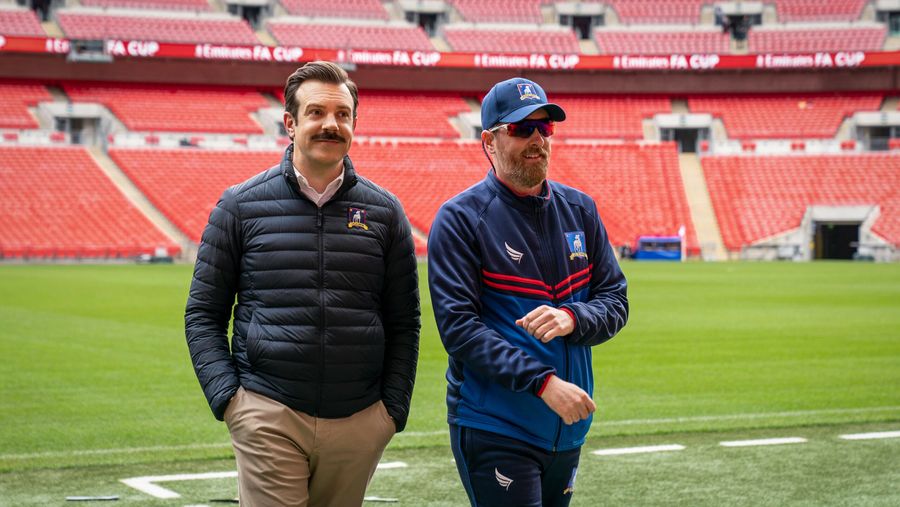 Ted Lasso and Coach Beard on field