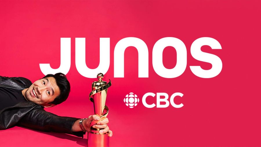 Simu Liu holding a Juno Award