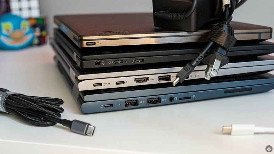 Several laptops stacked on top of each other.
