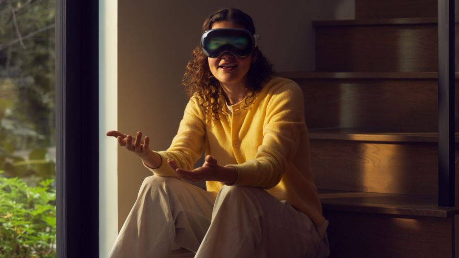 Person wearing Apple Vision Pro header.