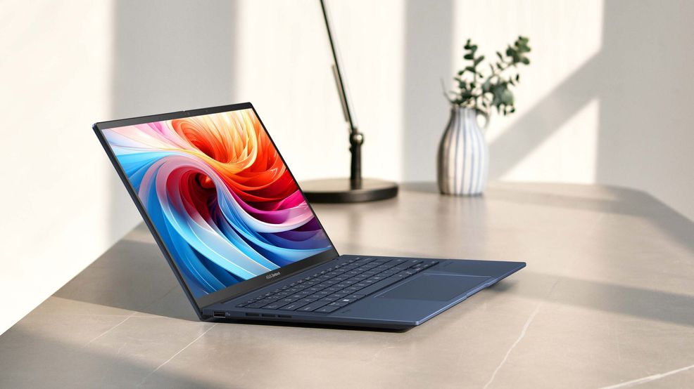 Asus Zenbook 14 OLED on a desk.