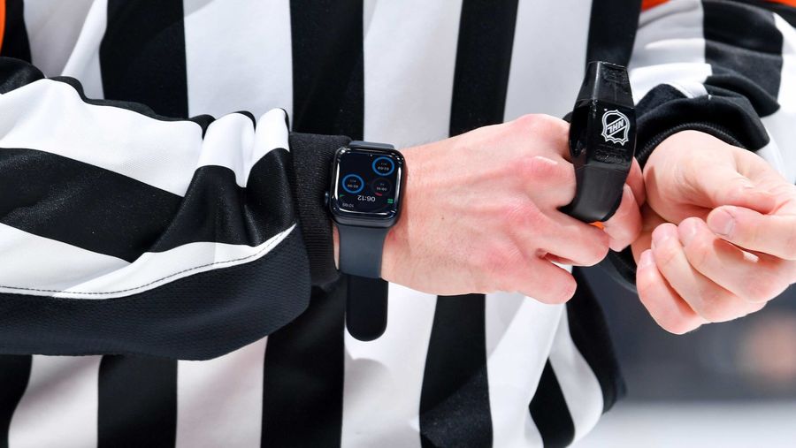 An NHL referee wearing an Apple Watch