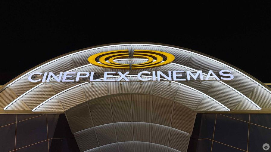 Cineplex theatre exterior at nighttime