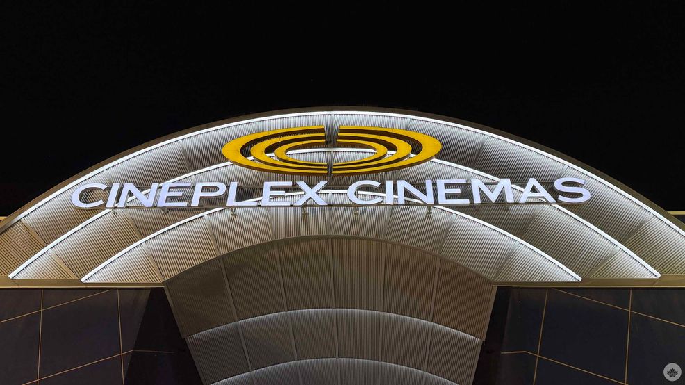 Cineplex theatre exterior at nighttime