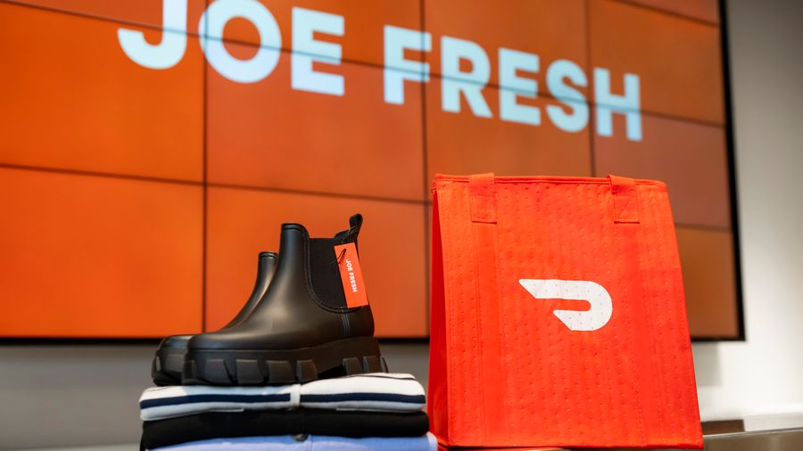 DoorDash bag next to a Joe Fresh boot