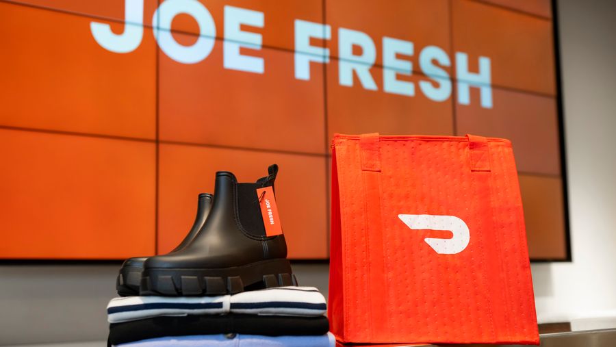DoorDash bag next to a Joe Fresh boot