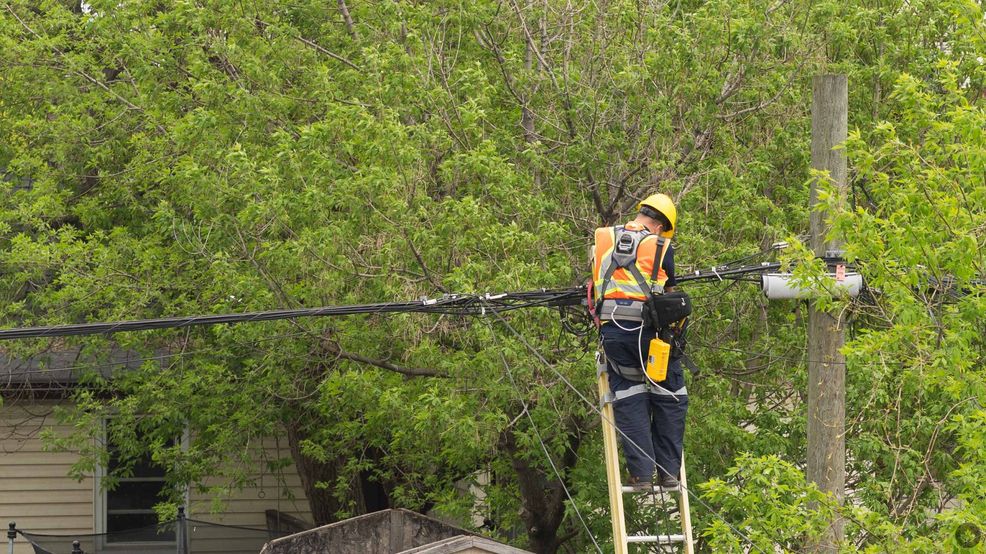 Cogeco tech working on cable line.